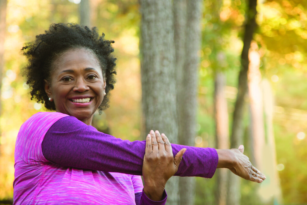 Senior women stretching outdoors
